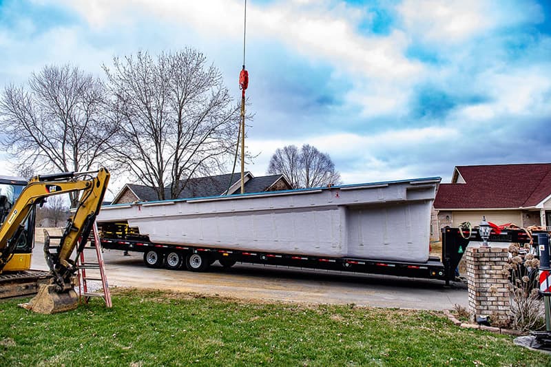 Delivering and placing a Leisure Pools fiberglass swimming pool