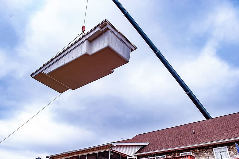 Fiberglass Pool Installation: Delivering and placing of a Leisure Pools composite pool