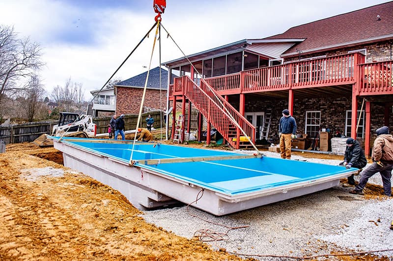 Delivering and placing a Leisure Pools fiberglass swimming pool