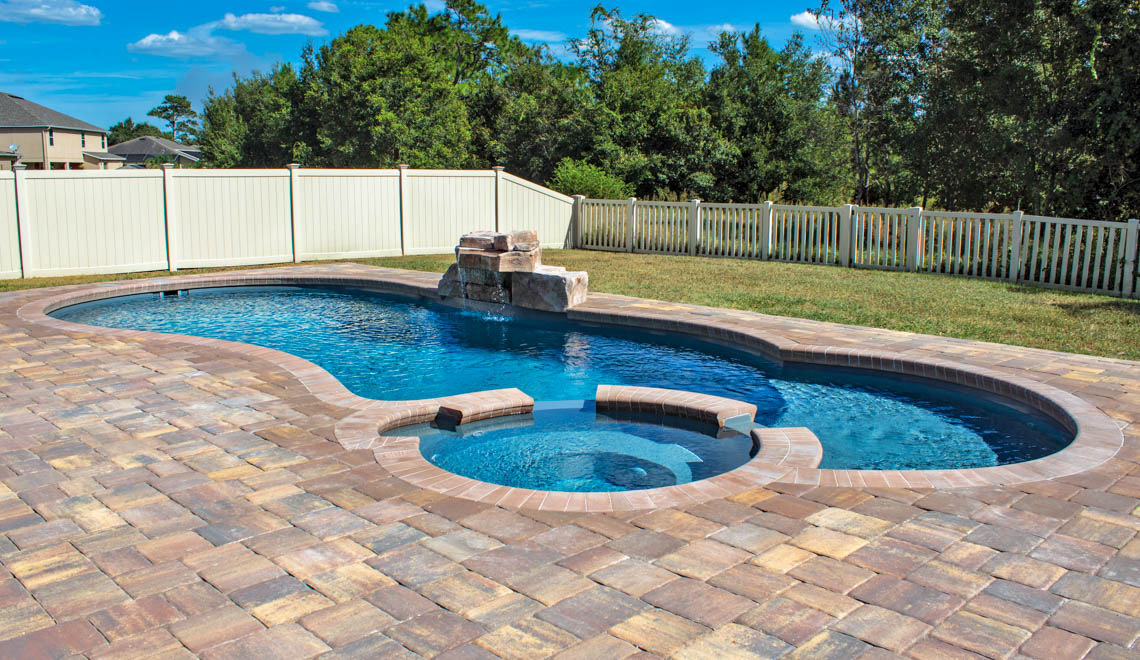 Leisure Pools Allure large in-ground composite swimming pool with built-in spa and splash deck