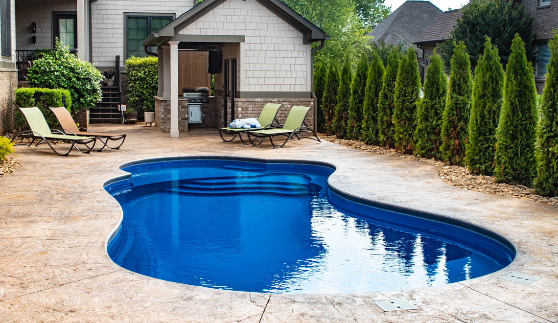 Leisure Pools Eclipse composite fiberglass swimming pool with built-in splash deck