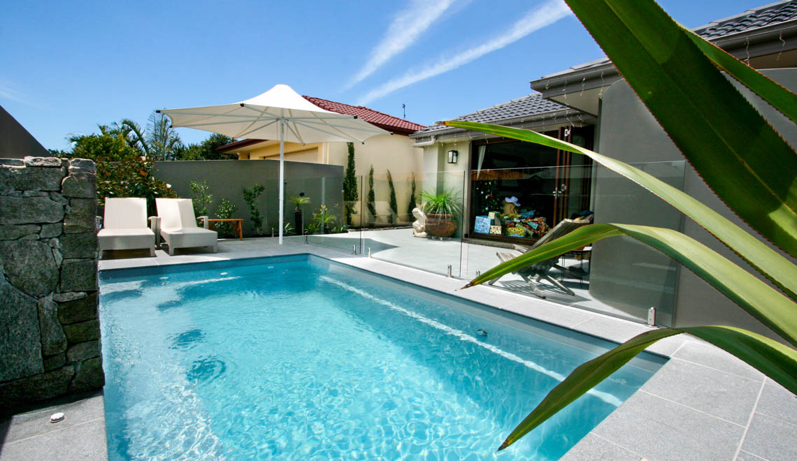 Leisure Pools Harmony fiberglass swimming pool with perimeter swimout