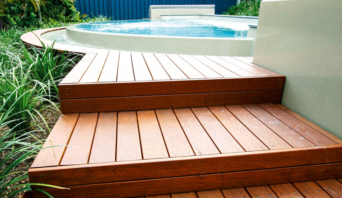 Leisure Pools Horizon fiberglass swimming pool with an infinity edge