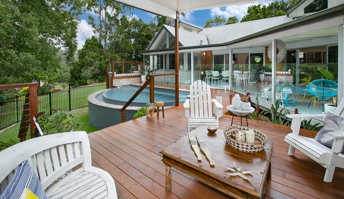 Leisure Pools Horizon composite fiberglass swimming pool with an infinity edge