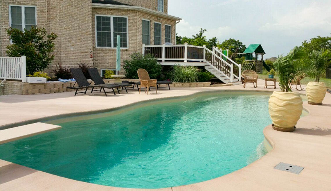 Leisure Pools Mediterranean fiberglass freeform swimming pool with unobstructed swimming corridor