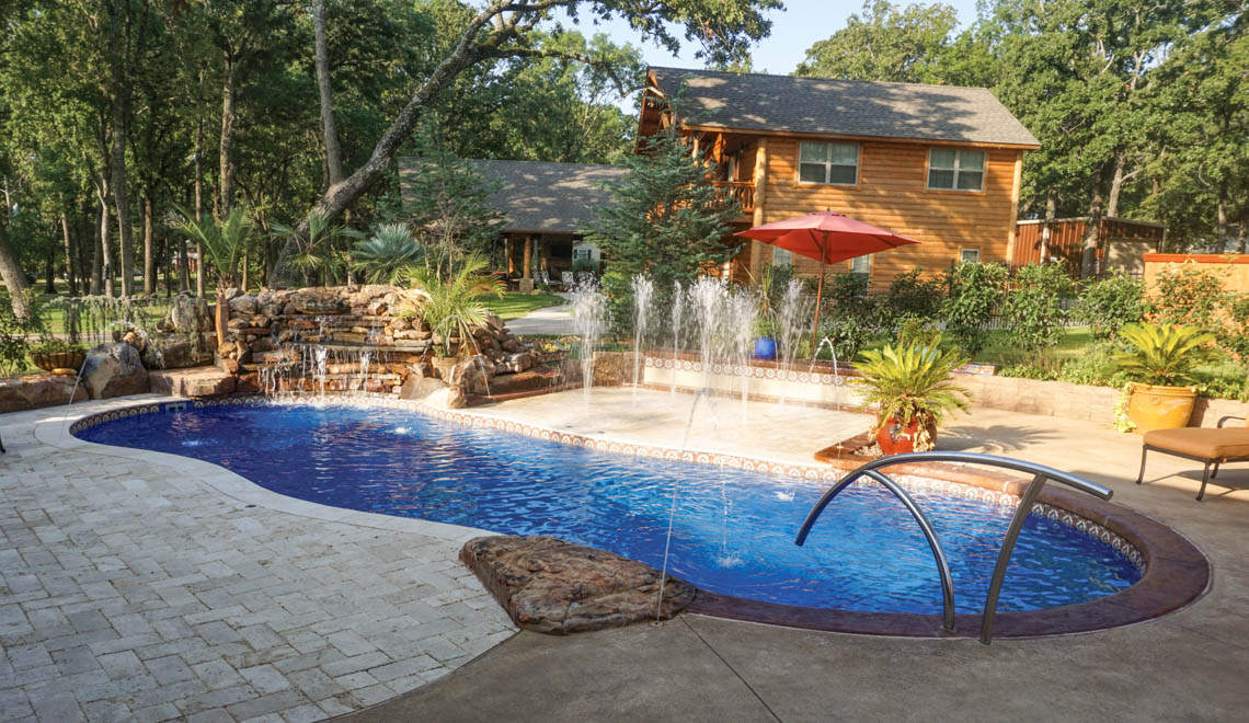 Leisure Pools Mediterranean large freeform swimming pool with wrap-around ben