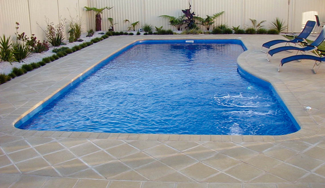 Leisure Pools Moroccan large composite swimming pool with stairs and spa nook