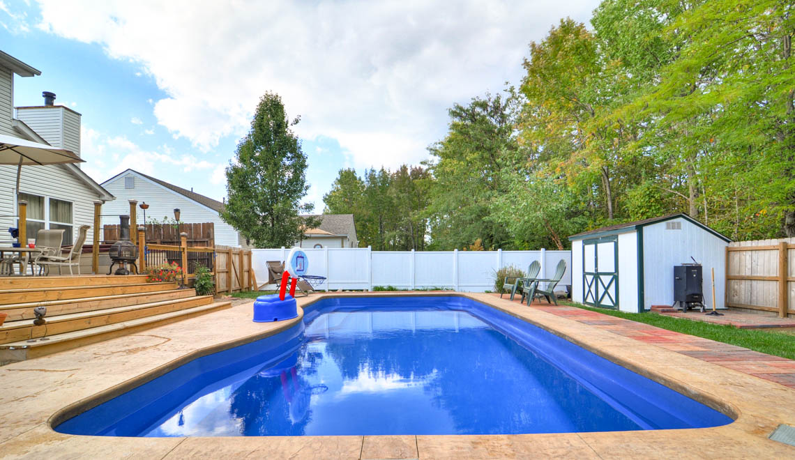 Leisure Pools Moroccan large fiberglass swimming pool with warp-around perimeter swimout