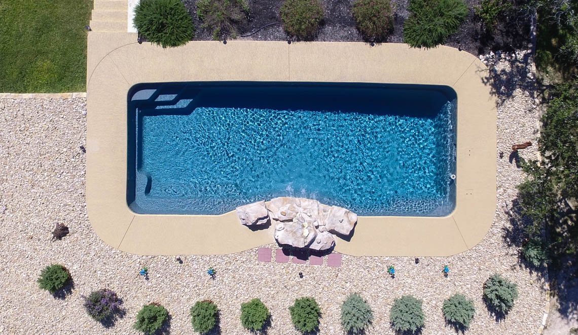Leisure Pools Moroccan large composite swimming pool with built-in spa nook and steps