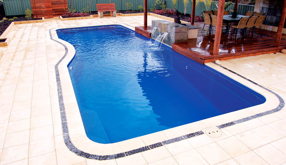 Leisure Pools Moroccan fiberglass swimming pool with built-in perimeter swimout