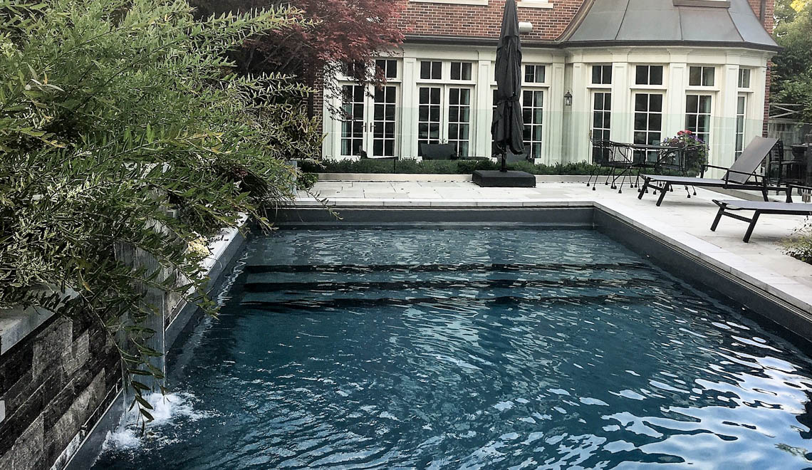 Leisure Pools Pinnacle large fiberglass swimming pool with built-in splash deck