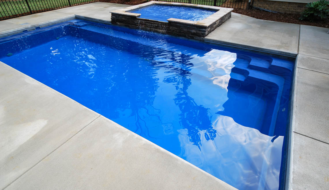 Leisure Pools Reflection composite swimming pool with full-length bench seat