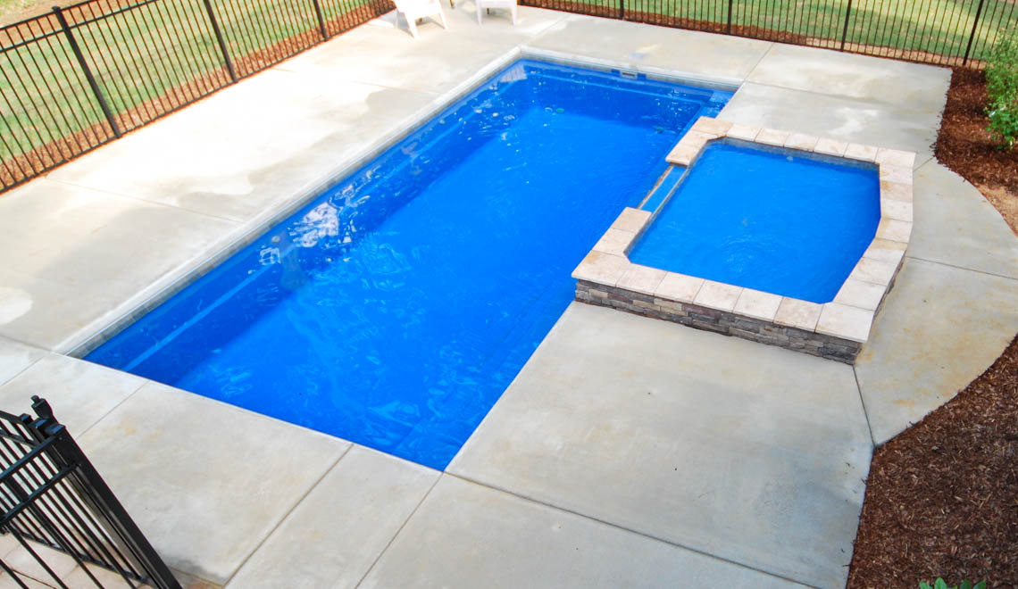 Leisure Pools Reflection composite fiberglass swimming pool with perimeter swimout
