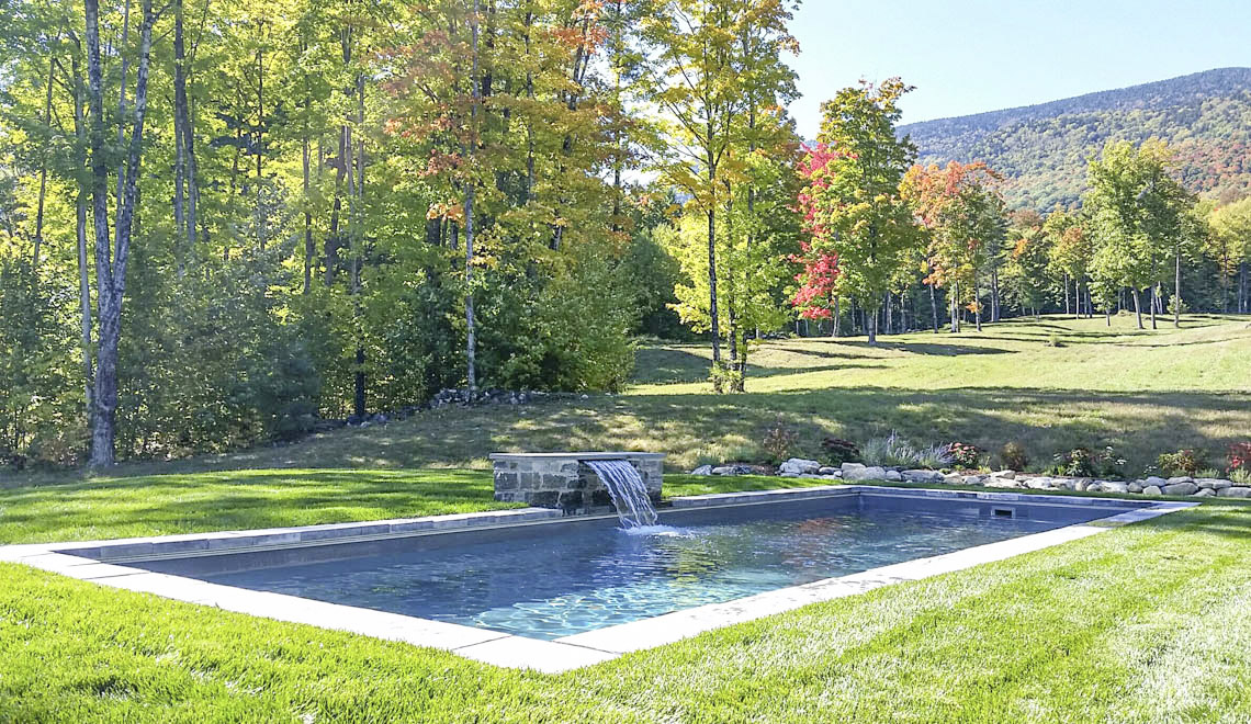 Leisure Pools Reflection composite fiberglass swimming pool with full-length bench seat
