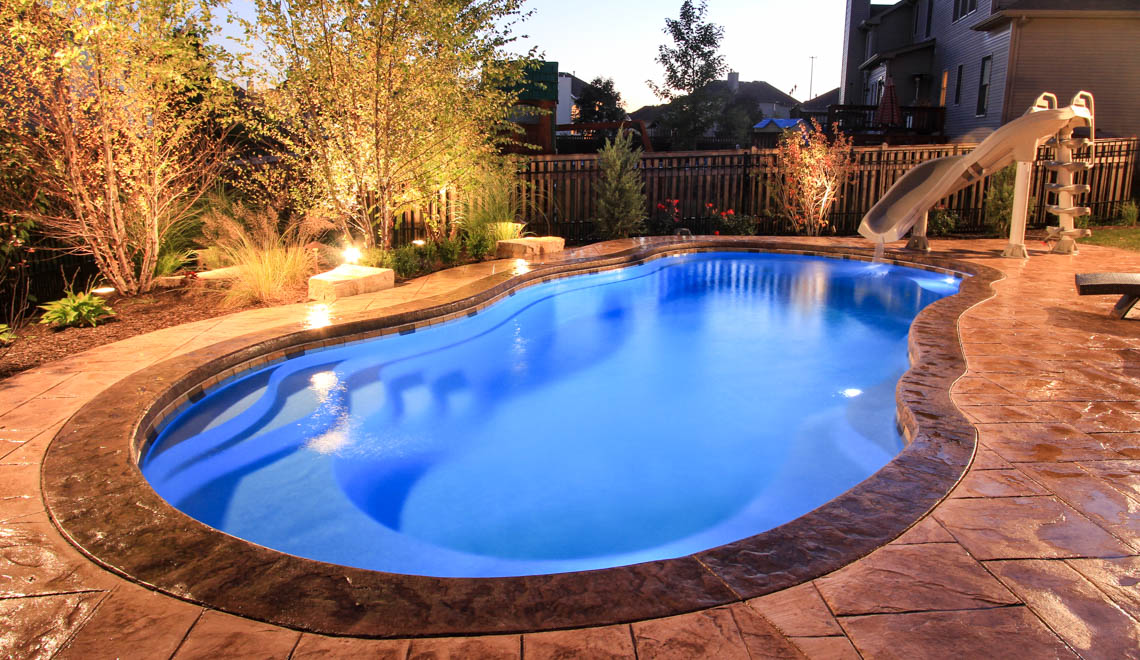 Leisure Pools Riviera large composite freeform swimming pool with deep end swimout