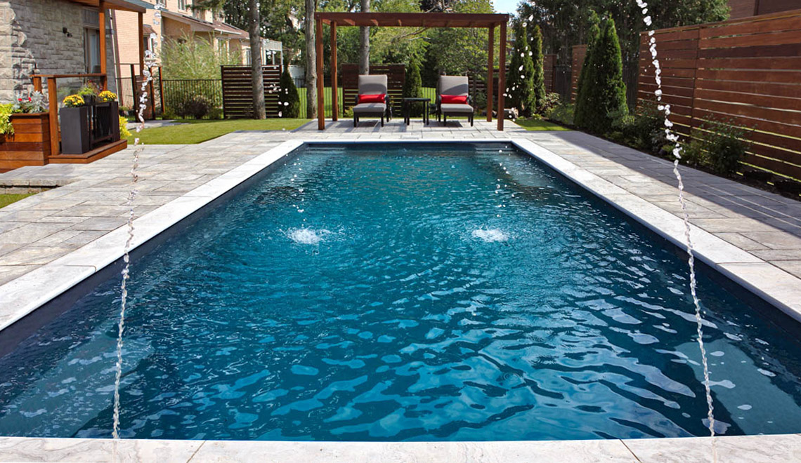 Leisure Pools Supreme composite in-ground swimming pool with deep end swimout and bench seats