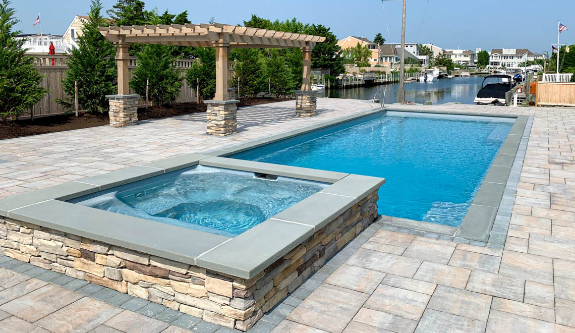 Leisure Pools Supreme composite in-ground swimming pool with perimeter swimout