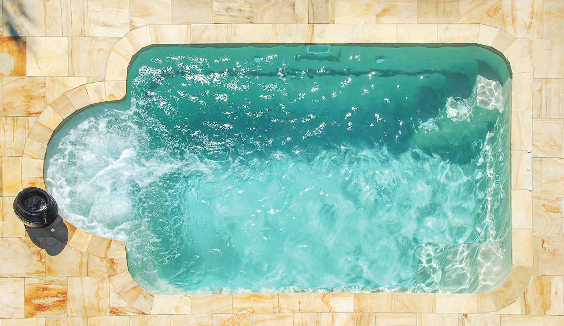 Leisure Pools Courtyard Roman compact fiberglass swimming pool