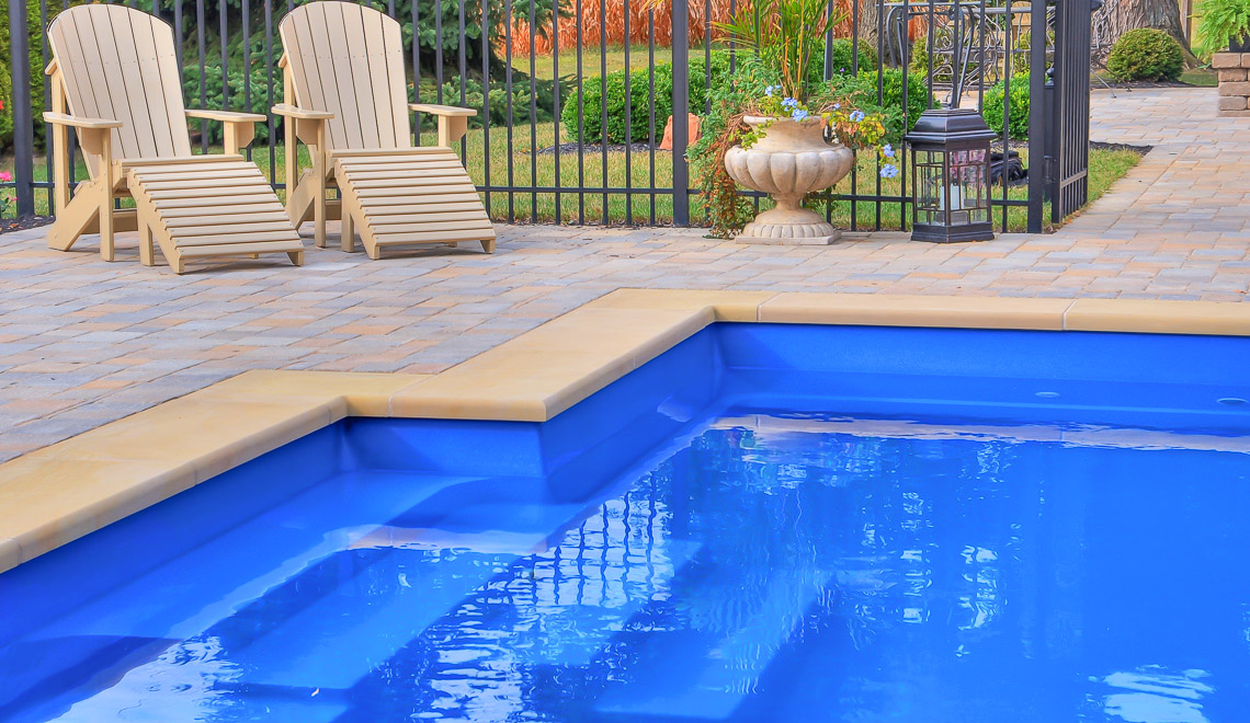 Leisure Pools Elegance fiberglass swimming pool with perimeter swimout