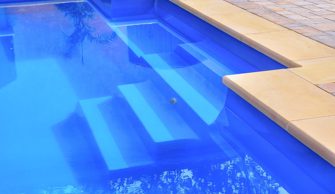 Leisure Pools Elegance precast swimming pool with built-in bench seat