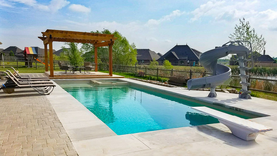 Leisure Pools Icon composite swimming pool with built-in spa and splash deck
