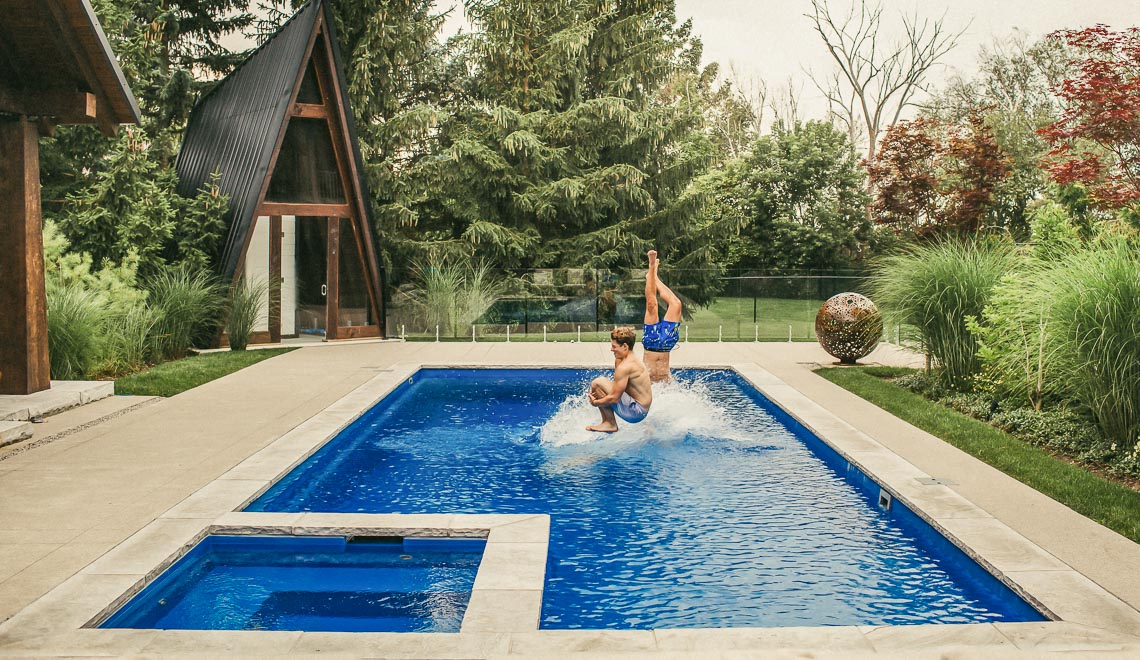 Leisure Pools Icon fiberglass diving pool with built-in spa and splash deck