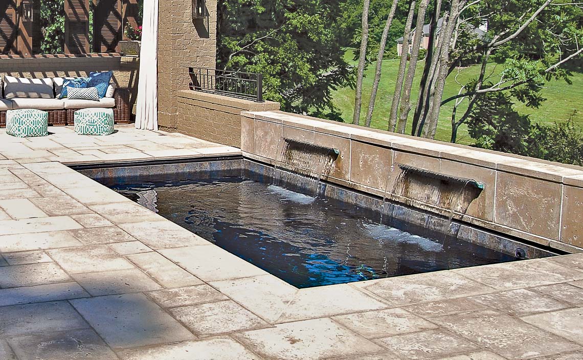Leisure Pools Palladium Plunge fiberglass swimming pool with wrapped bench area