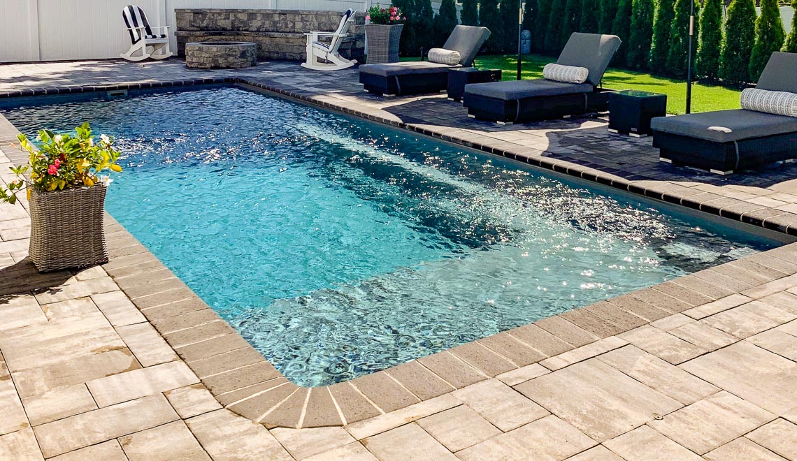 Leisure Pools Reflection with Splash Desk composite in-ground swimming pool