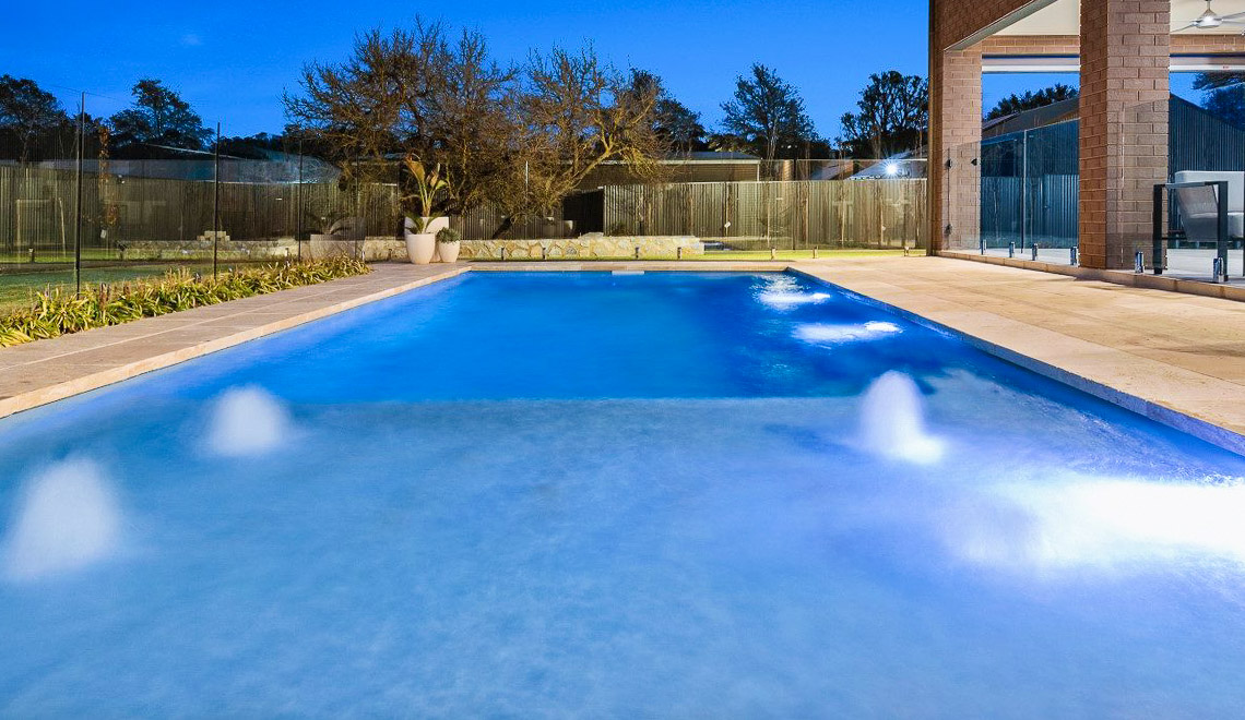 Leisure Pools Reflection with Splash Desk composite fiberglass swimming pool