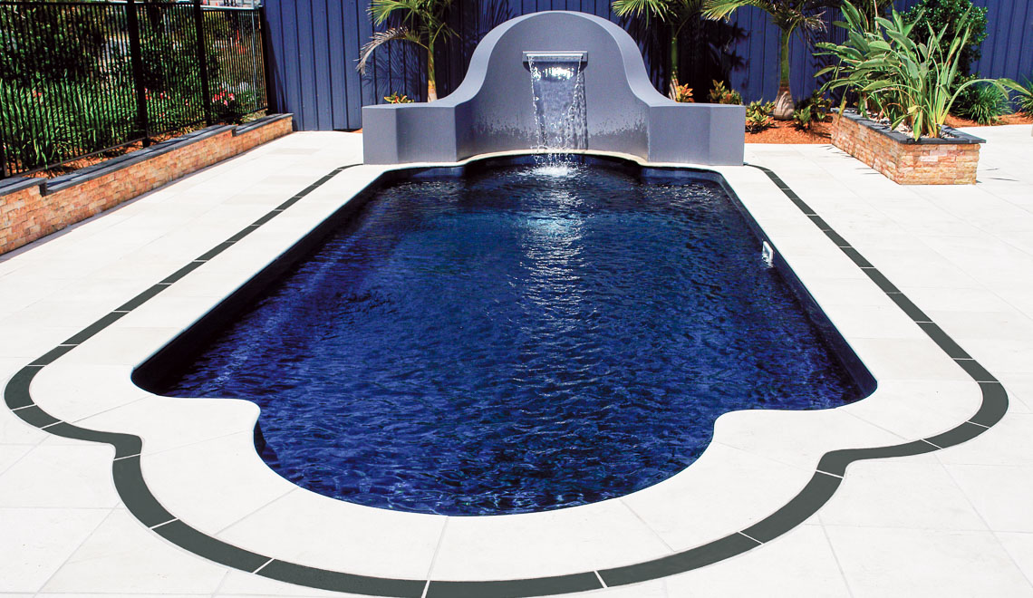 Leisure Pools Roman composite fiberglass swimming pool with perimeter swimout