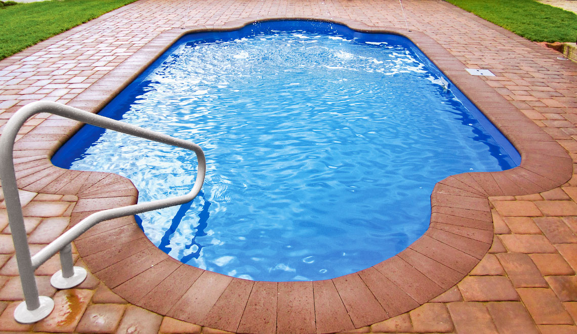 Leisure Pools Roman large fiberglass swimming pool with perimeter swimout