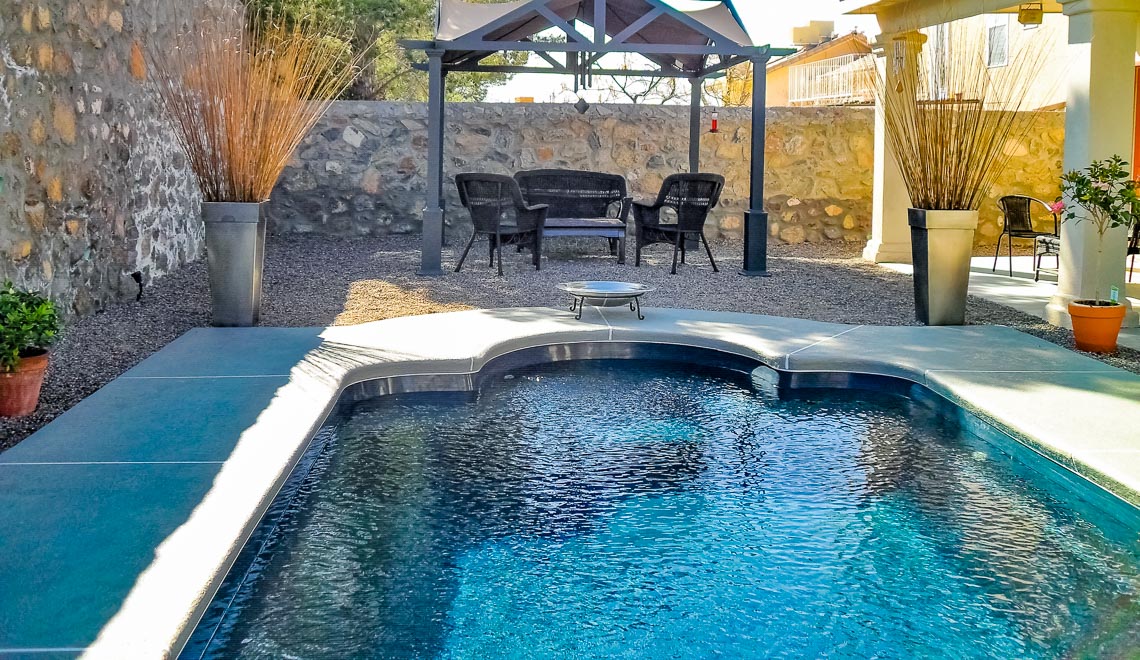 Leisure Pools Roman composite fiberglass swimming pool with perimeter swimout