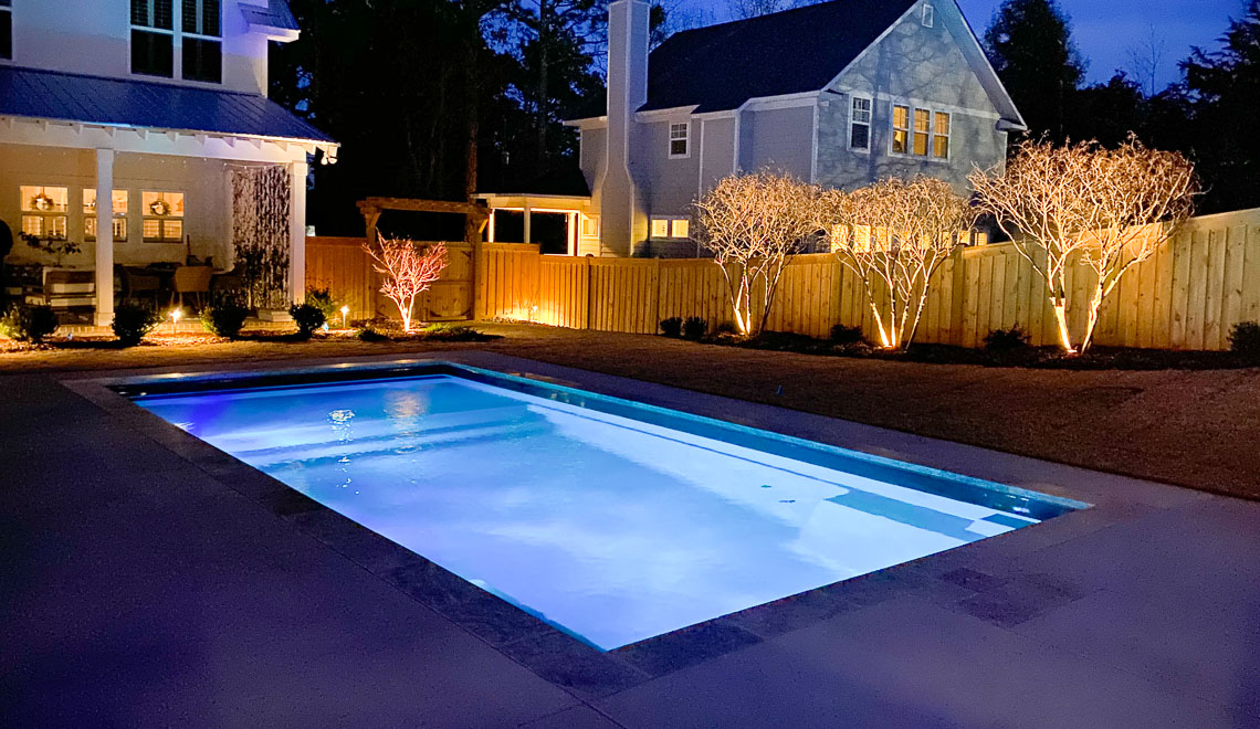 Leisure Pools Summit large one-piece swimming pool with integrated splash deck
