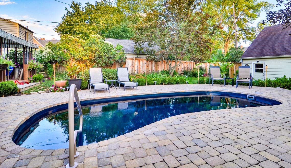 Leisure Pools Tuscany freeform fiberglass swimming pool with perimeter swimout