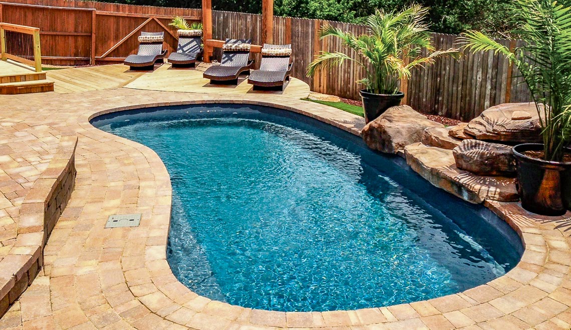 Leisure Pools Tuscany freeform composite swimming pool with deep end bench seat