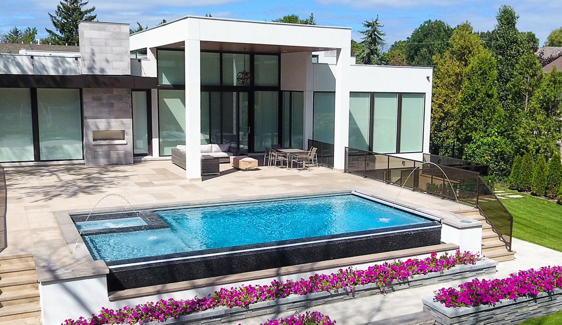 Leisure Pools Ultimate rectangular swimming pool with built-in spa and tanning ledge