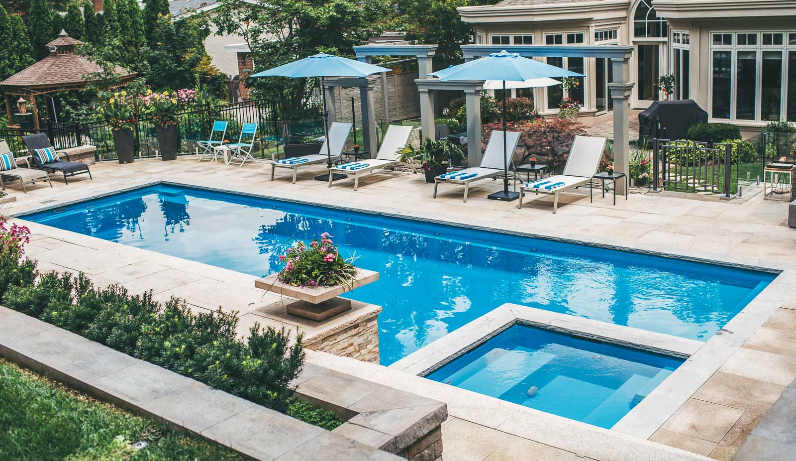 Leisure Pools Ultimate large composite unground pool with built-in spa and tanning ledge