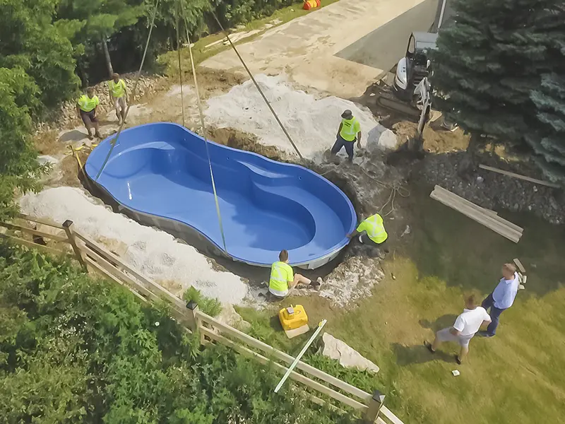 Fence providing privacy for inground fiberglass swimming pool