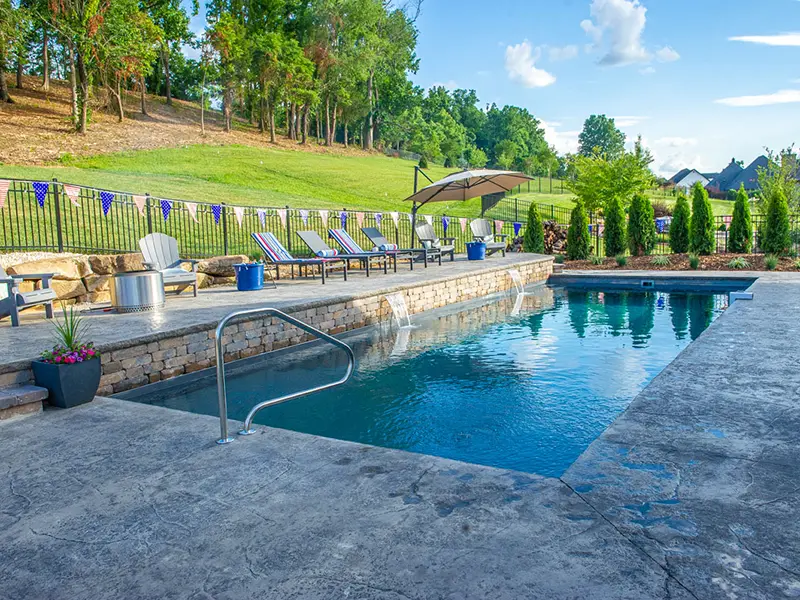 Leisure Pools Pinnacle 40 fiberglass swimming pool decorated for 4th of July