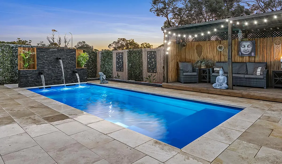 Beautiful pool coping around a Leisure Pools fiberglass pool