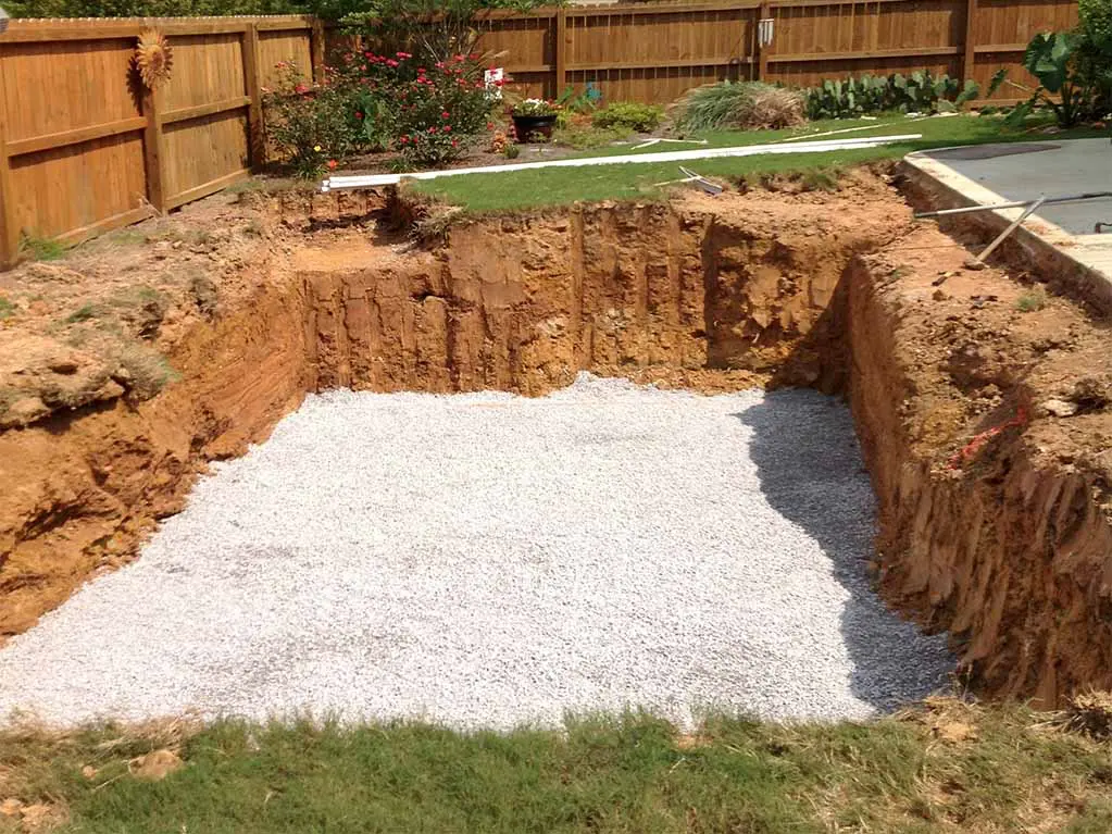 layer of crushed stone in a hole