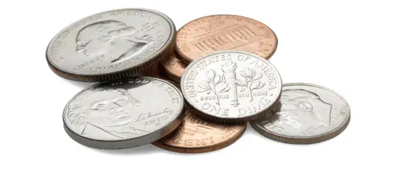 Nickels and dimes scattered, symbolizing the affordability and long-term value of investing in a premium fiberglass pool from Leisure Pools.