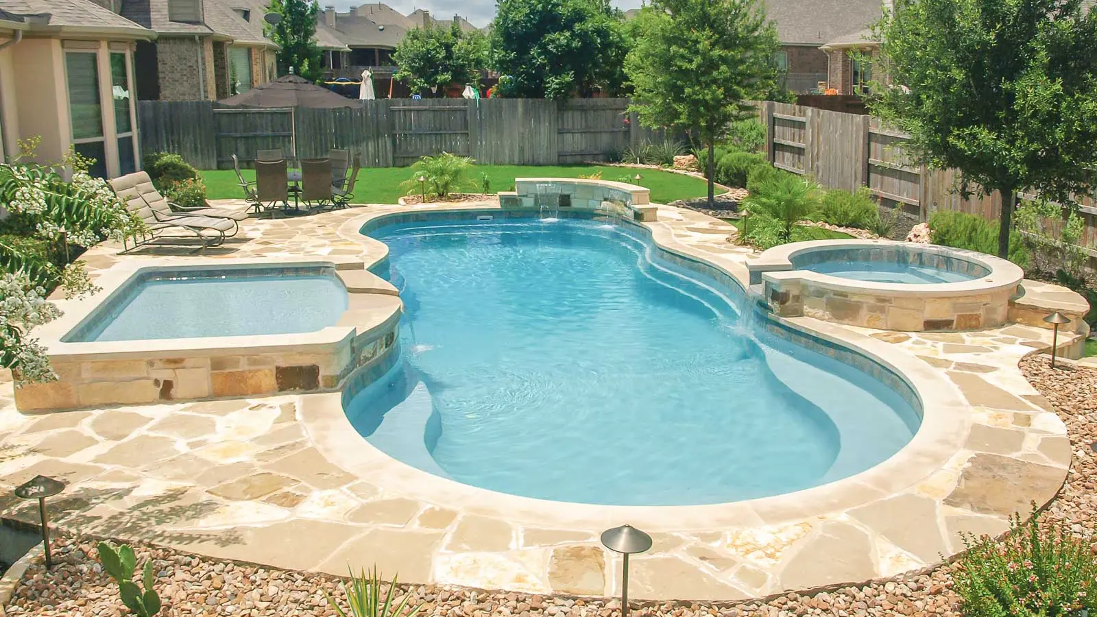 The Caribbean, a fiberglass pool with a wraparound entry bench
