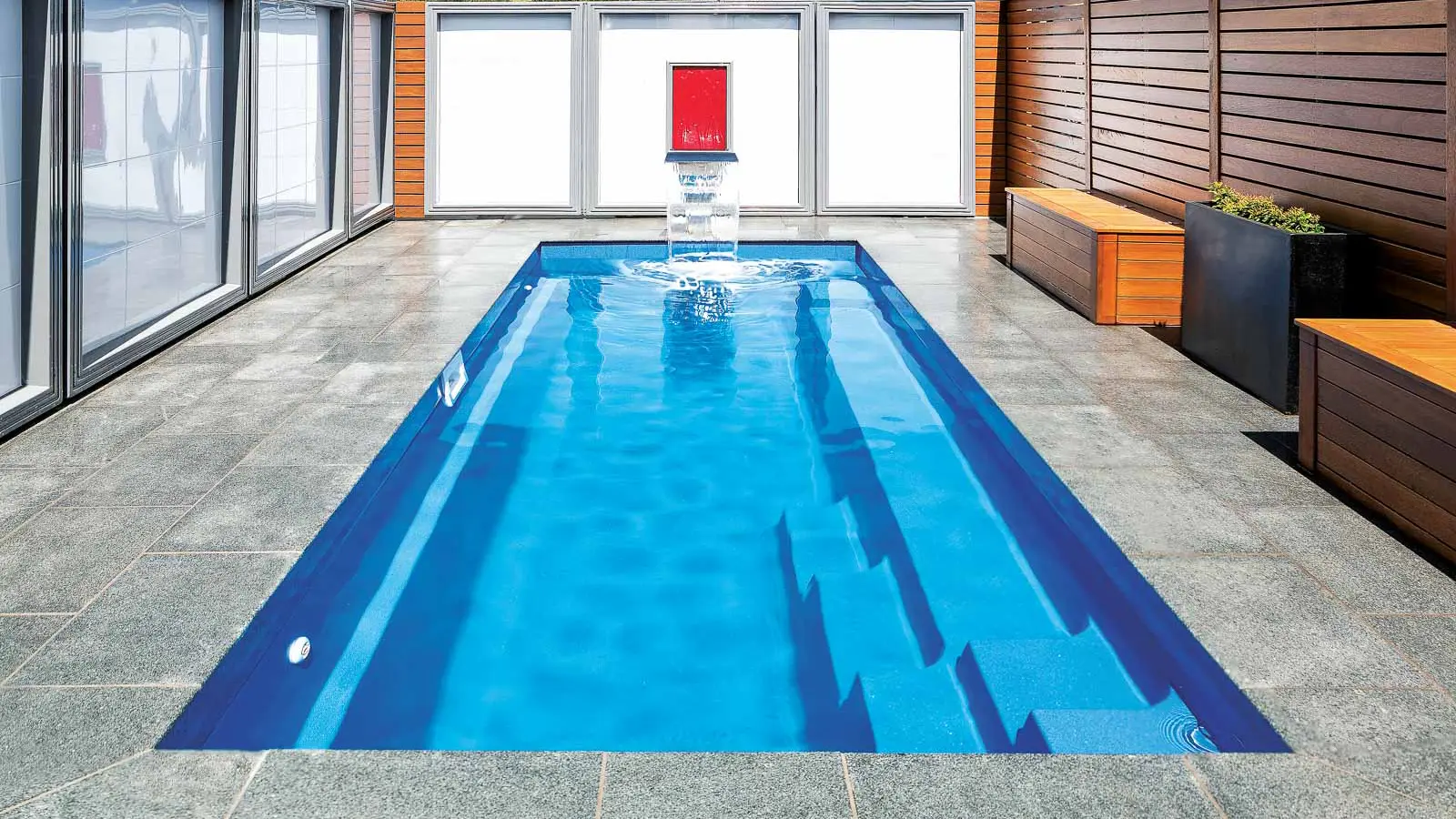 The Esprit, a fiberglass pool with full length bench seating