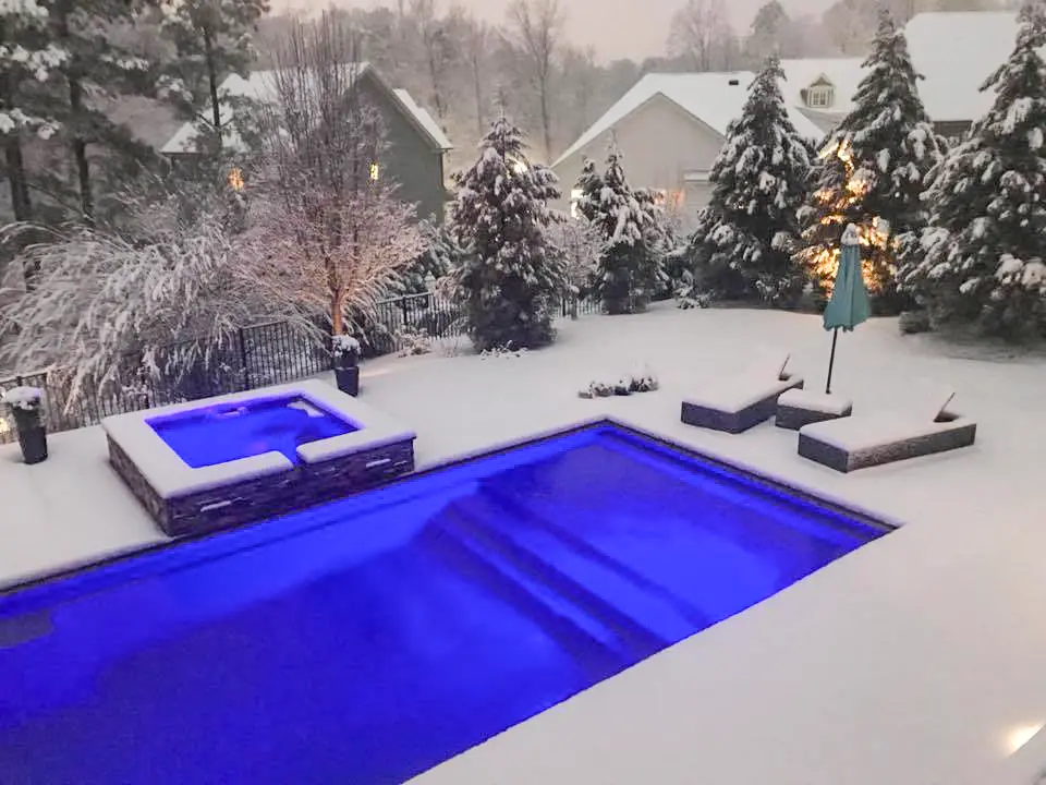 Leisure Pools USA Pinnacle Inground Fiberglass Swimming Pool in the snow