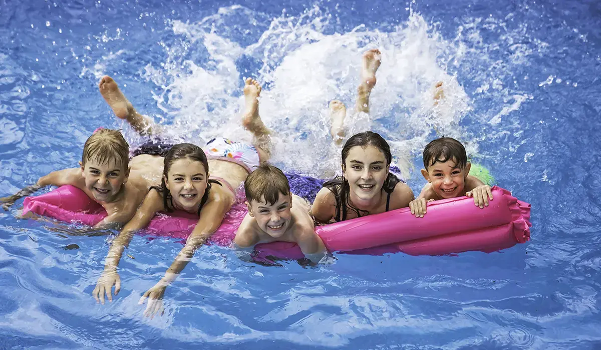 Back to School pool party in a fiberglass inground swimming pool