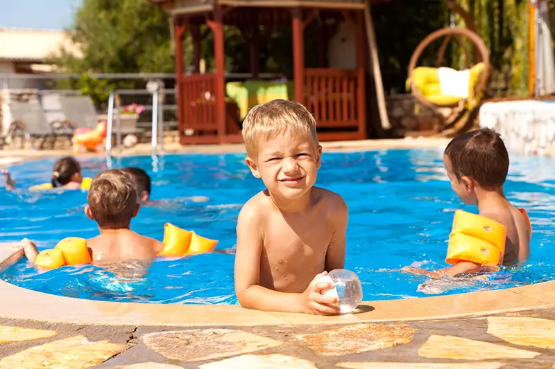 Kids back-to-school party at an inground fiberglass pool