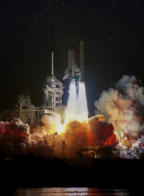 Space shuttle launching into the sky, symbolizing Leisure Pools' industry-leading innovations as a manufacturer, with cutting-edge technology, premium materials, and exceptional quality standards.